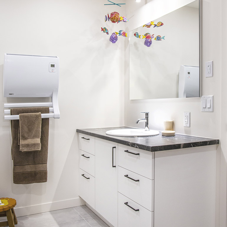 Cuisines Beauregard |Bathroom with white melamine cabinets and black granite look-alike laminate countertop